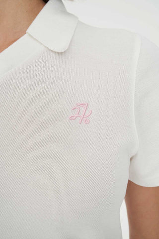 WOMENS BIRDIE SS POLO/PAR 97 CHALK/PETAL